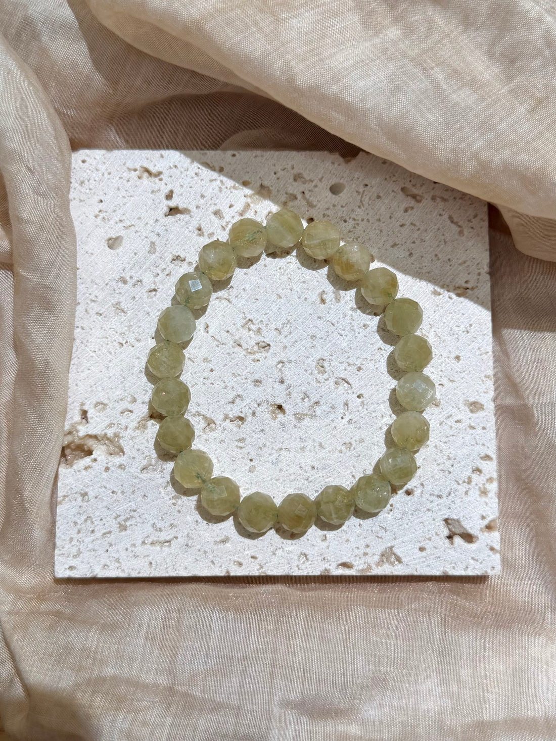 Pale Solstice natural faceted green quartz bracelet flat lay